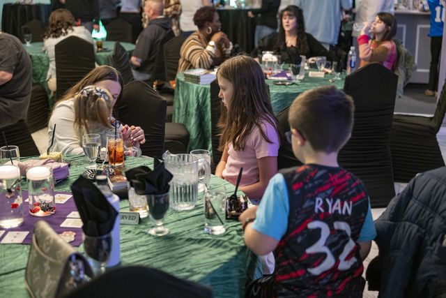 Book release party: Guests seated at tables during the party