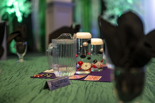 Book release party: Close-up of a table setting with a place card and card-suit centerpiece