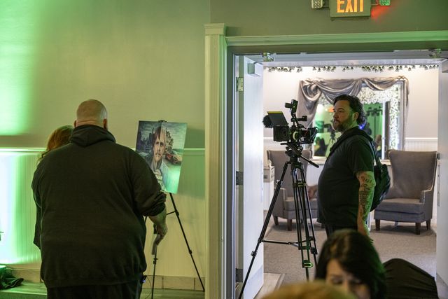 Book release party: Camera crew filming in the hallway