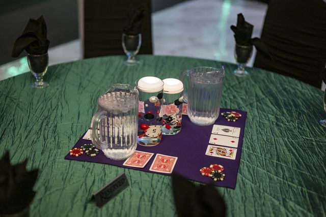 Book release party: Table set with playing cards, poker chips and a water pitcher