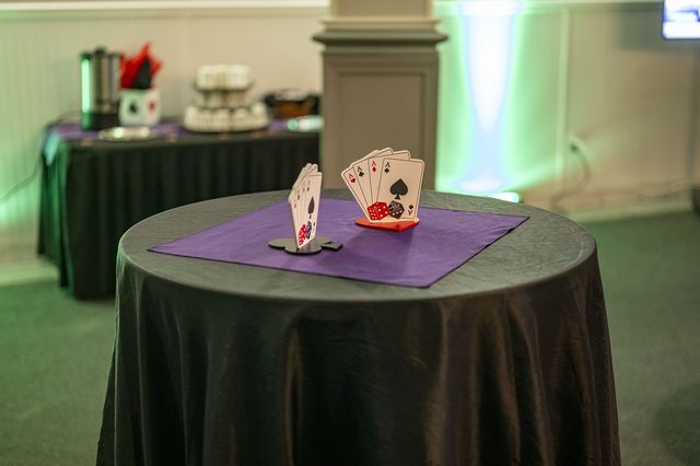 Book release party: Cocktail table with a playing-card centerpiece