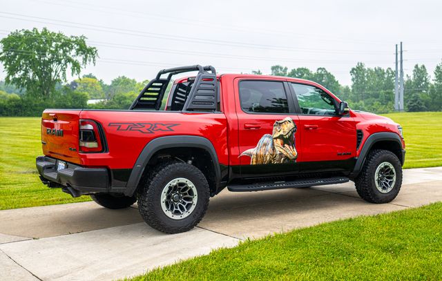 Red pickup truck with a custom graphic
