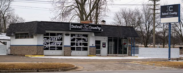 Small commercial building with a roadside sign