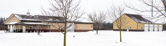 Low buildings on a snowy lot