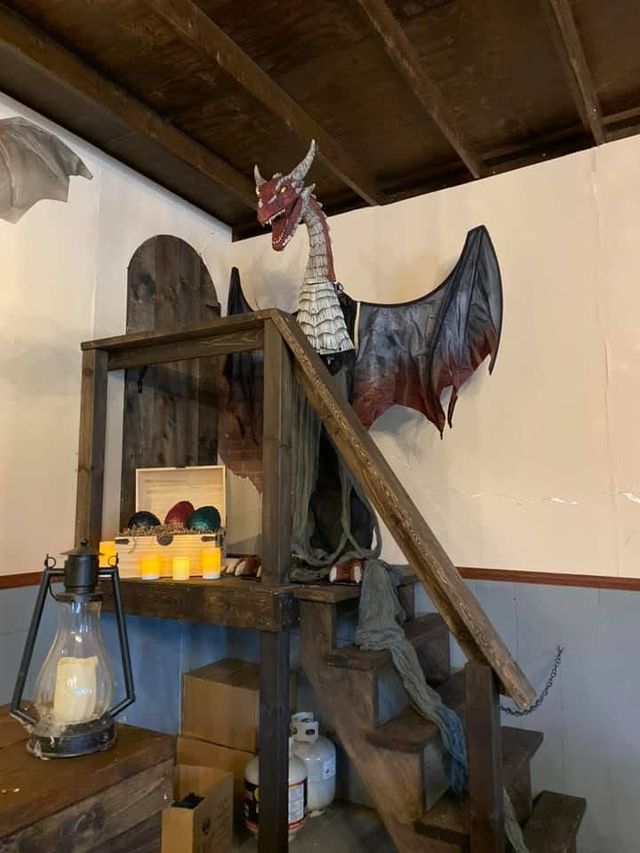 A dragon sculpture above a staircase