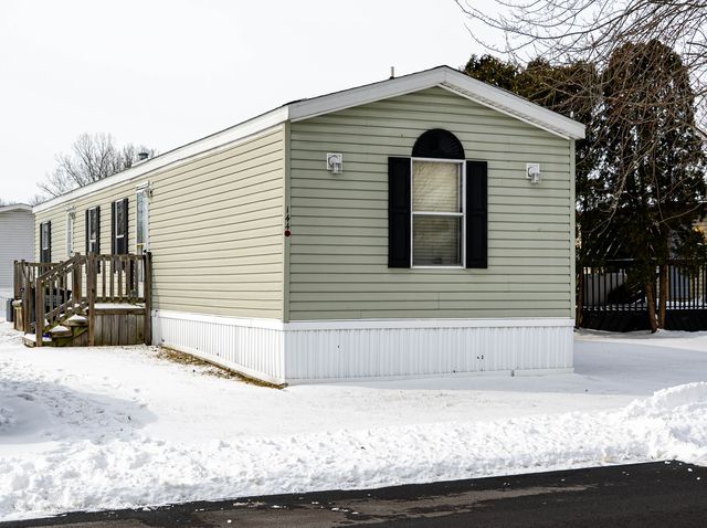 Single-wide mobile home in the snow
