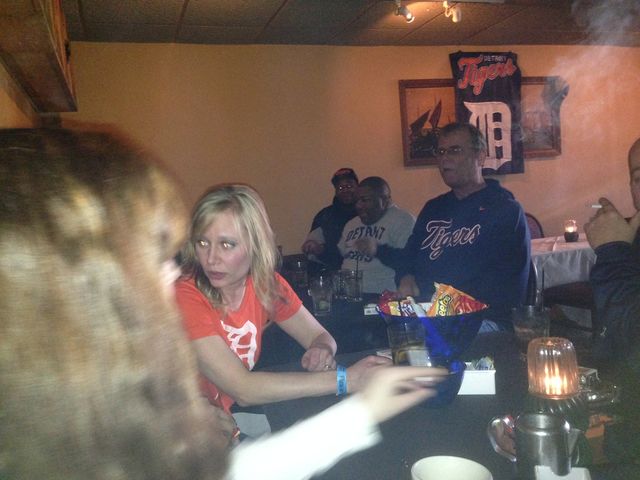 A woman at a crowded bar table