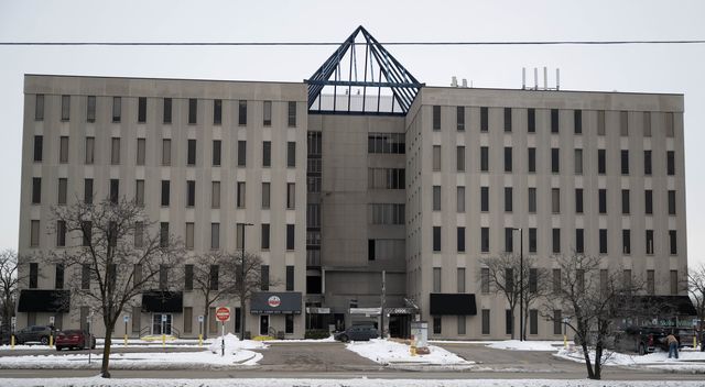 Office building with a glass pyramid entrance