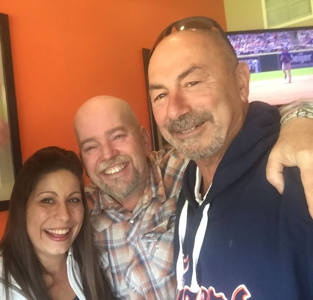 Three friends at a ballgame