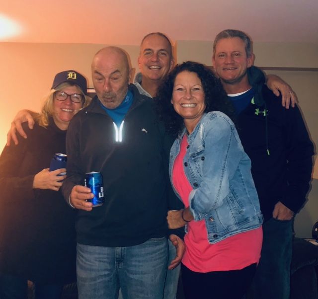 Friends posing together at night