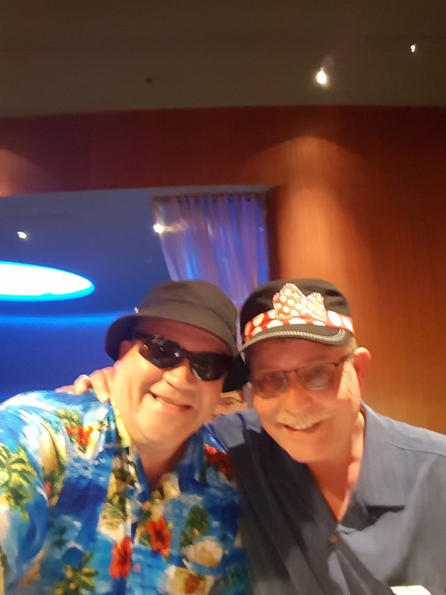 Two men in sunglasses taking a selfie