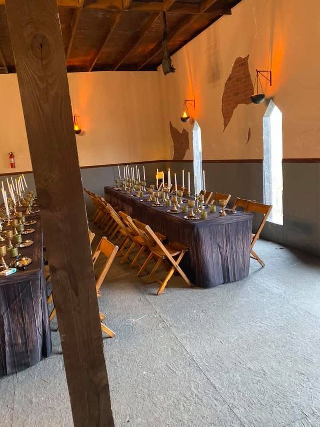 Candlelit banquet room with a long table