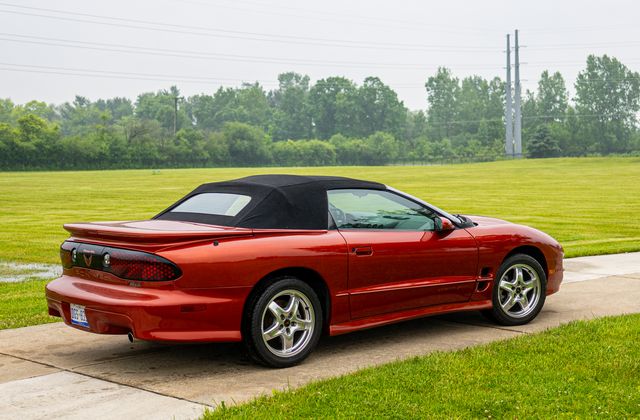 Red convertible with a black top