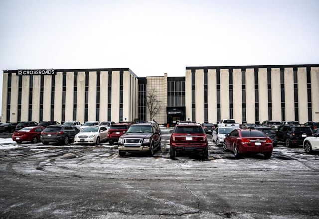 Office complex with a full parking lot in winter